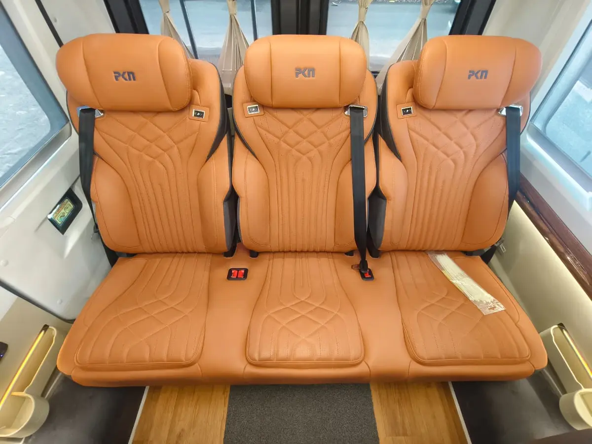 Welcome Trips Ultra Luxury Urbania rear three-seat bench with premium tan upholstery and seat belts